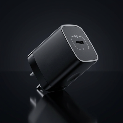 Black USB-C wall charger with cinematic studio lighting